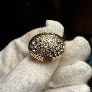 Versace Gold color. With clear crystals in Ring.